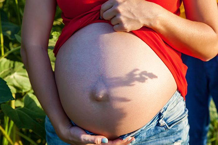 pregnant girl in sunlight