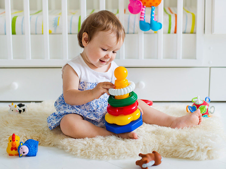 1 year old playing with toys