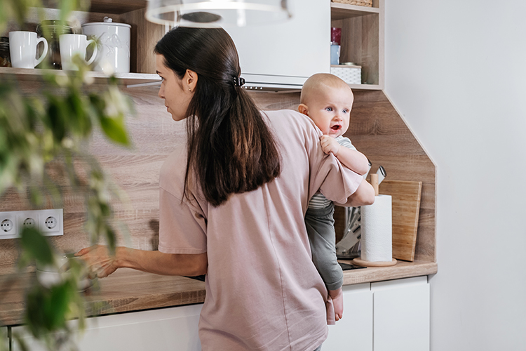 mom working with baby in hand.jpg