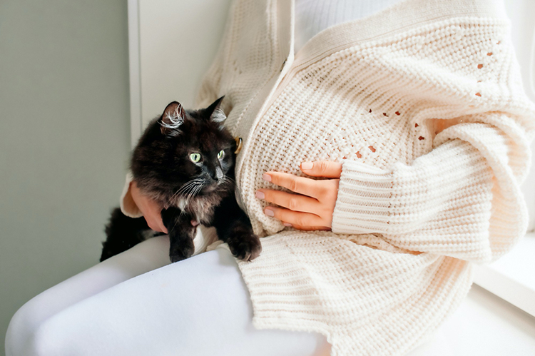 pregnant woman with a cat