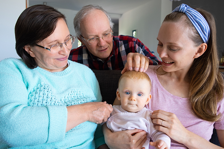 grandparents spending time with newborn