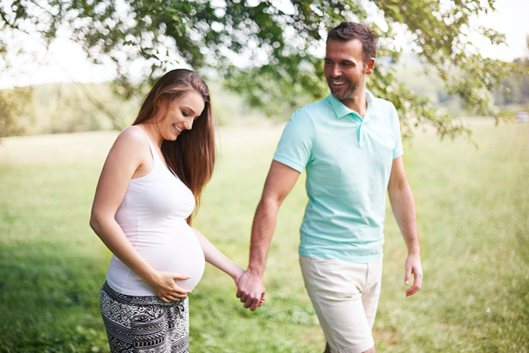 pregnant couple walk