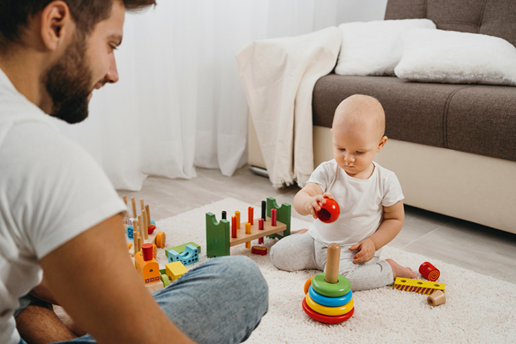 dad playing with baby