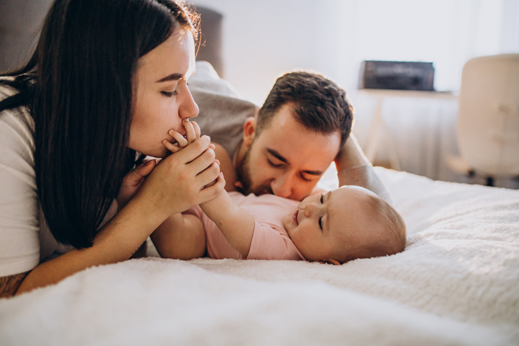 mom dad playing with baby