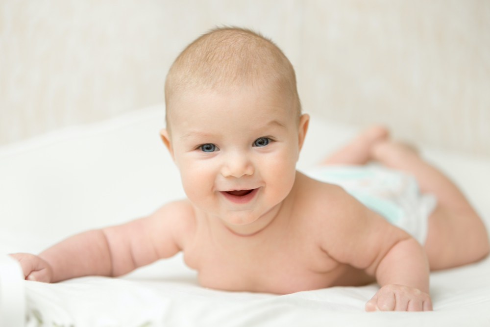 baby girl smiling playing