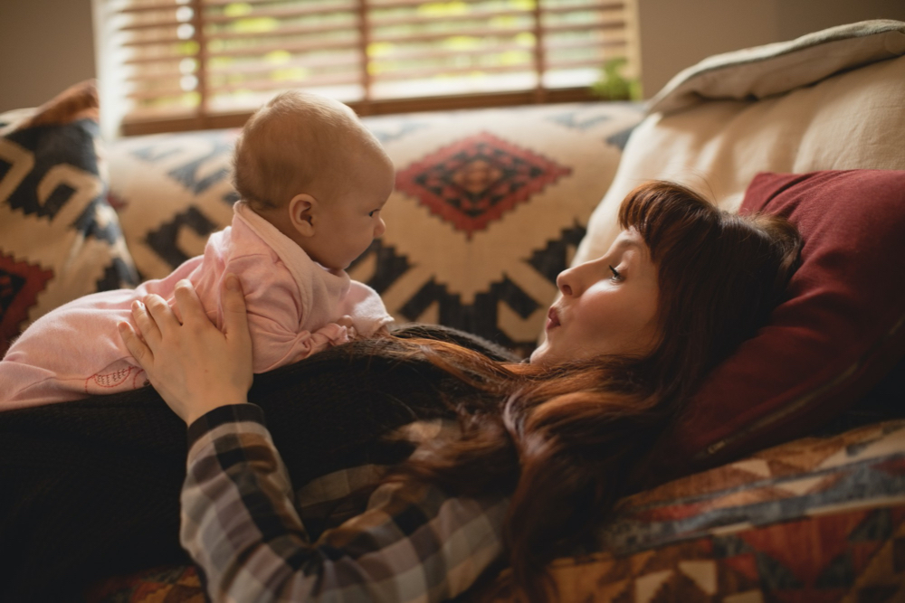 mom playing with baby girl