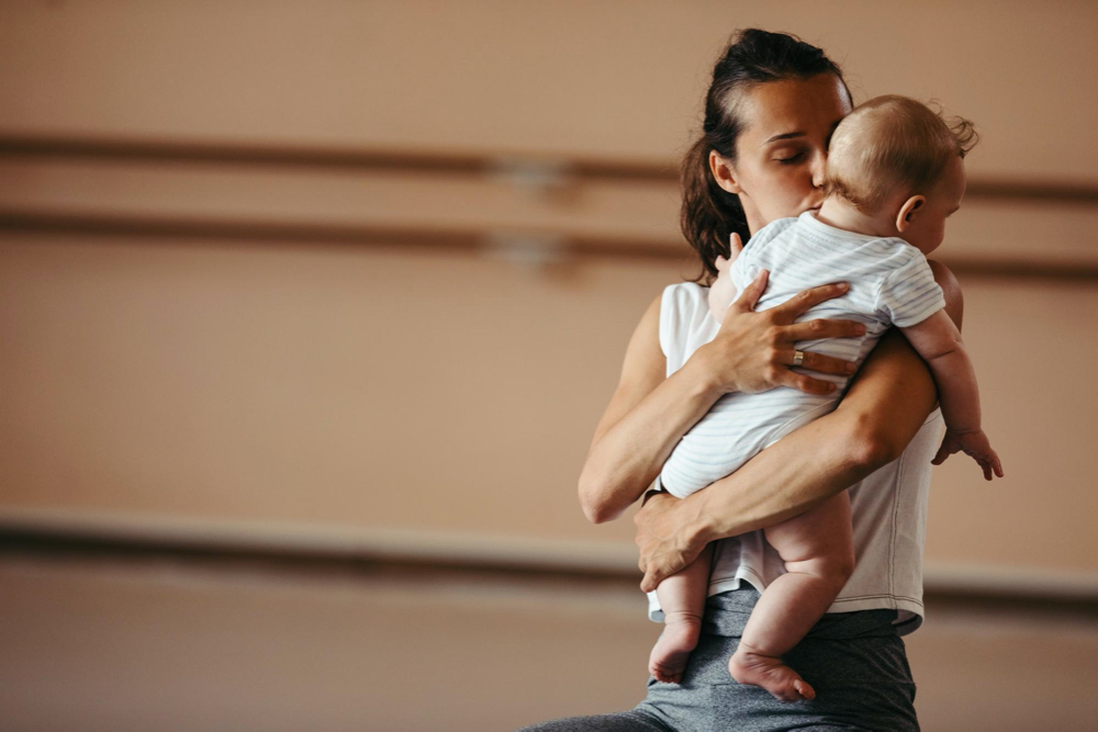 mom with baby in exercise class