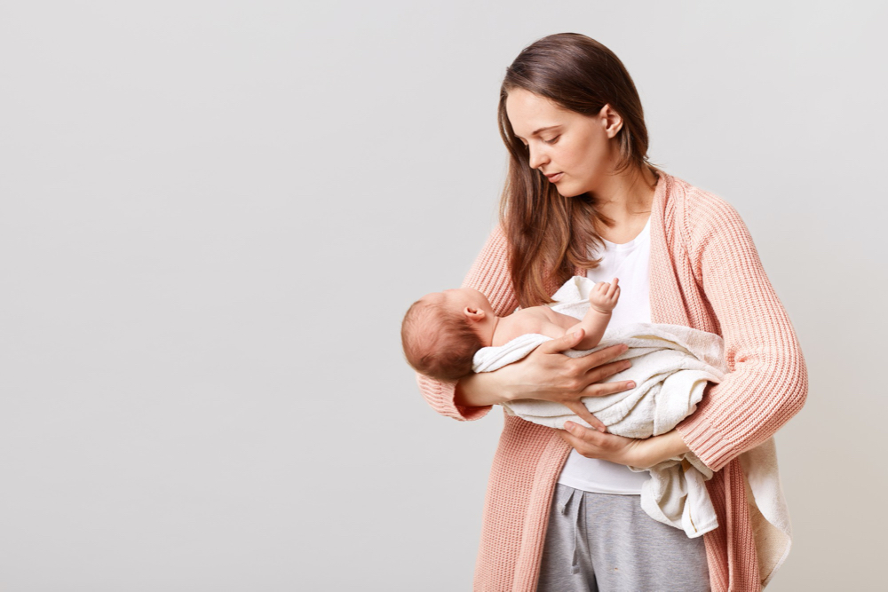 new mom holding newborn baby