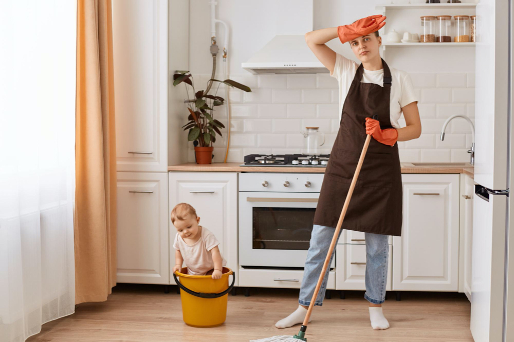 mom cleaning with baby