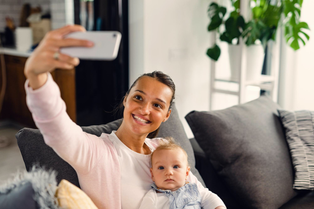 taking selfie with a baby