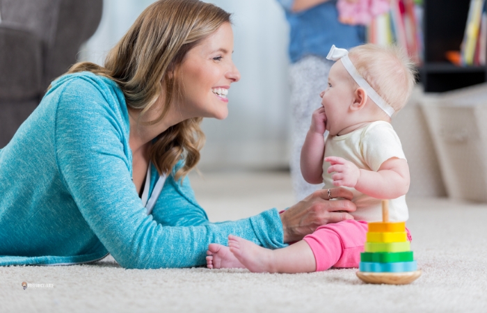 baby laughing with mom